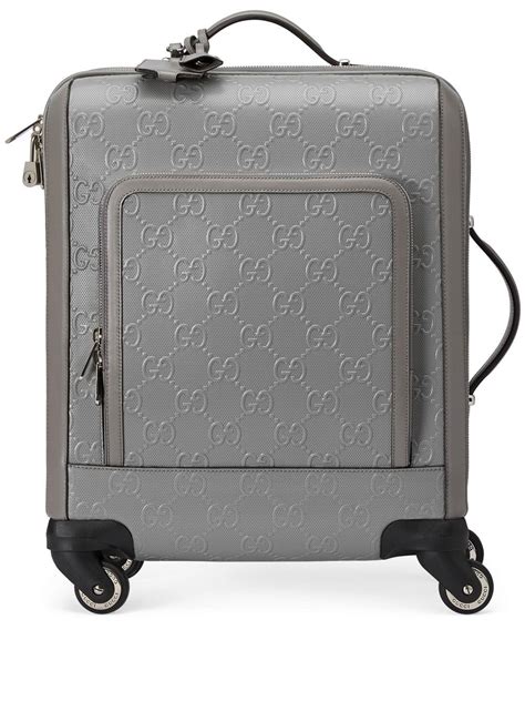 embossed luggage Gucci